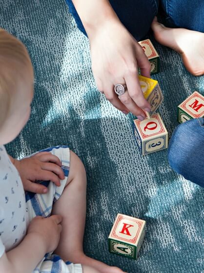 Infant Playing with Blocks